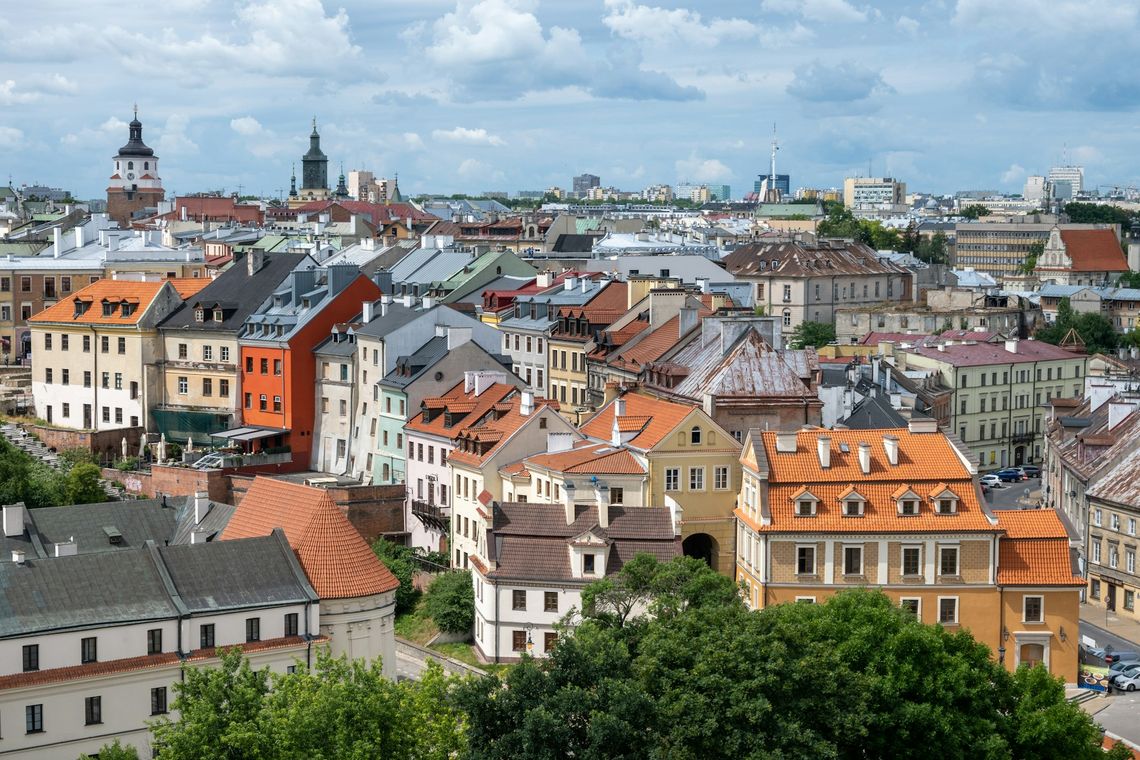 Lublin - The Gem of Lublin Region and Practical Travel Tips a city with lots of tall buildings and lots of trees