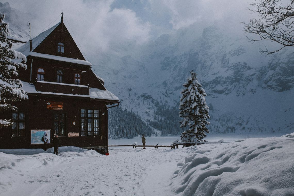 Zakopane - The Beauty of the Polish Tatra Mountains and Practical Travel Tips a cabin in the mountains covered in snow