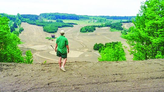 Bahle Farms is celebrating their 25th anniversary this month. Somewhere around 1998, a man imagines swinging his drive from a dirt hill that is now Bahle Farms. Courtesy photo