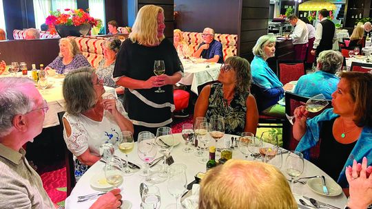 Kim Zachariah of Black Star Farms presents wine during a 10-day Rhine river cruise in Germany and France last week. Courtesy photo