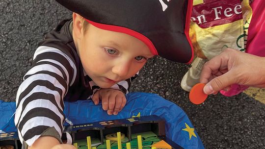 Charlie Drow dressed as a pirate for Lake Leelanau St. Mary trunk-ortreat event Friday. Enterprise photo by Mike Anderson