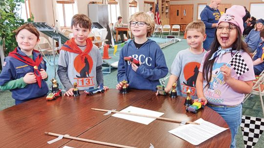 The Wolf Den Cub Scouts display colorful cars they created and the trophies they received at the Pack 131 Pinewood Derby. From left to right: Phillip Bradford, Declan Draper, Logan Hutcheon, Zac Richter and Nokami Kwe Winchester. Photos courtesy of Lynn Bakker