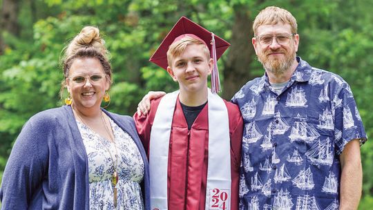 Sarah, Harrison and Matthew Johnson point to their faith and the quick action of Leelanau County first responders for surviving an explosion that destroyed their home. Many of those responders will be attending Matthew’s graduation open house this weekend. Courtesy photo