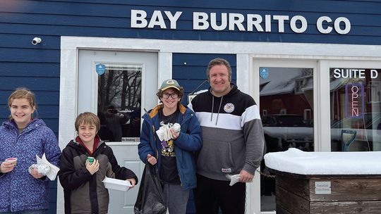 The Fillipp family from Vila Park, Illinois waits patiently to be the first customers of Bay Burrito in 2024. From left to right: Violet, Luke, Ben and Andy Fillipp. Courtesy photo
