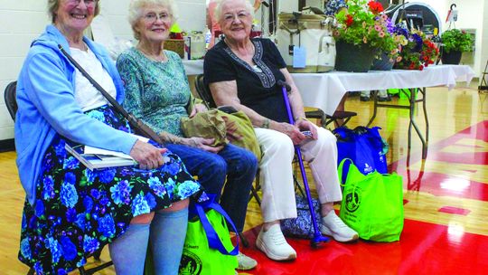 From left to right: Kathy Darga, Joan Skipski, and Liz Drzwiecki of Cedar and Maple City enjoyed their time at the Senior Expo at Suttons Bay High School on Tuesday where hundreds of seniors gathered to see 100 vendors in the gymnasium. See brief, Page 3. Enterprise photo by Brian Freiberg...