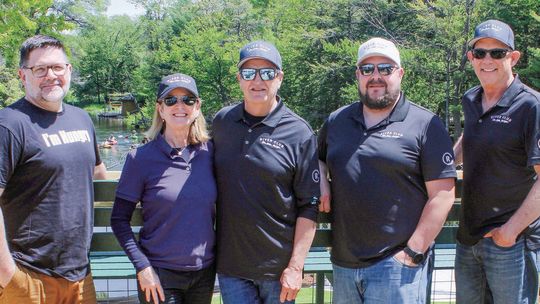The River Club in Glen Arbor is preparing to open on June 20. From left to right: Steven Brotschul, Gina and Mike Sheldon, Matt Millu, and Chuck Damman. Enterprise photo by Brian Freiberger
