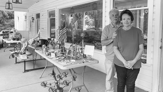 Glen Lake Manor Owner Susan Rife is pictured next to her husband, Rob, on August 30, the first day of their pre-renovation “sale on the porch” . Enterprise photo by Meakalia Previch-Liu