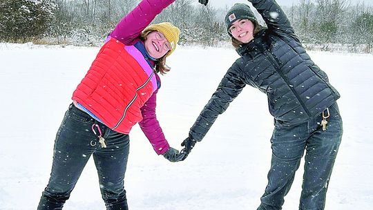 Youth volunteers pose while exploring Sleeping Bear Dunes National Lakeshore on snowshoes. Photo courtesy of the National Park Service.