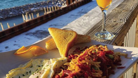 Knot Just a Bar’s corned beef hash, which includes roasted brisket, hashbrowns, onion and pepper with poached egg and Texas toast, is a favorite on the newly expanded breakfast menu. Courtesy photo