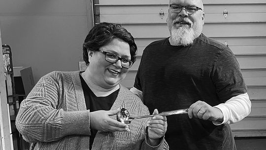 Patrice Korson smiles as last year's Souper-Bowl winner Mike Anderson, creative director, presents her with the coveted Silver Ladle Award. We will post Patrice's recipe in the online version of this story at leelanaunews.com. Enterprise photo by Meakalia Previch-Liu