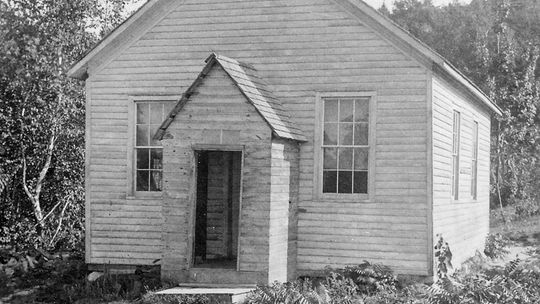 Here’s the North Unity School in 1906. The schoolhouse was originally of log construction. The siding and the front entry room (where firewood was stacked to dry) were added later, but have now been removed. Photo courtesy of Paul Dechow