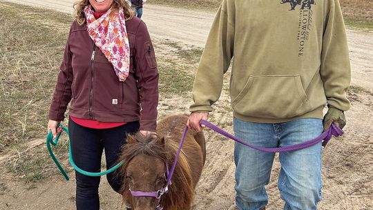 Michele Morris, caretaker of Lorelei and founder of Empire Hills Farm, is pictured reunited with the mini pony on Sunday. Good friend Kevin Crouch also showed up on Sunday to support the pony search efforts. Courtesy photo