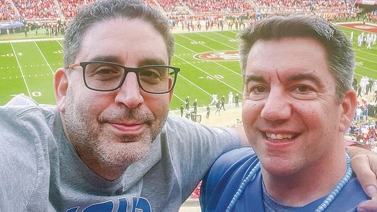 Matt Soltysiak, podcast host and Glen Lake Spanish teacher (right), went to the NFC Championship game with his friend Micheal Feinstein, who flew to San Francisco from Seattle. Courtesy photo