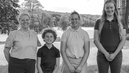 Pictured from left are Principal Megan Glynn, Michael Dunphey (fifth grade), Allison Duperon (eighth grade), and Leah Fleis (senior). Courtesy photo