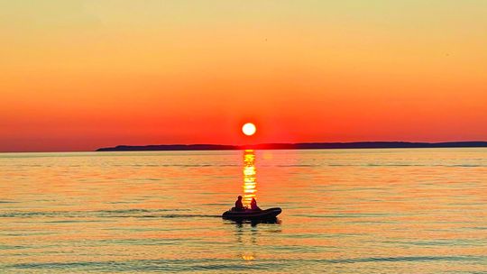People were out enjoying the vibrant sunset setting over Lake Michigan at Van’s Beach Monday evening. Enterprise photo by Meakalia Previch-Liu