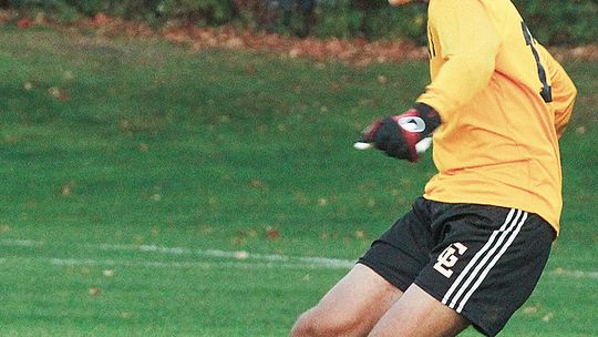 Glen Lake goalkeeper Anthony Forton clears the ball during a conference game earlier this month.