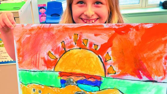 Iris Wild, a second grader at St. Mary, is a Grand Traverse Area Rock and Mineral Club pebble pup. Enterprise photo by Mike Anderson