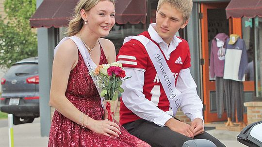 Suttons Bay senior Mya Kohler and Jackson Loucks ride in style during the 2024 Homecoming parade. Enterprise photos by Brian Freiberger