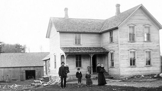 Richard and Katie Werner pose for a portrait with their family and home: from left Richard, Herman, August, Rachel, Katie, and Ella c. 1893 Photo Source: Preserve Historic Sleeping Bear Online Archive