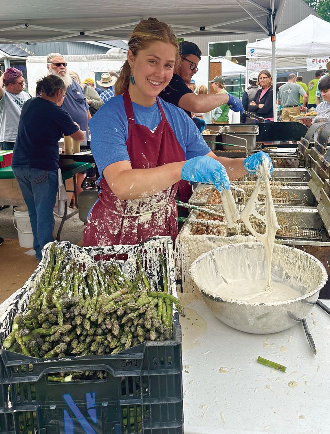 Grass-dippin’ at the Asparagus Festival. Workers from Art’s Tavern hustle to keep up with the asparagus lovers at the 21st Annual Asparagus Festival in Empire. Photo courtesy of Cindy Waldeck