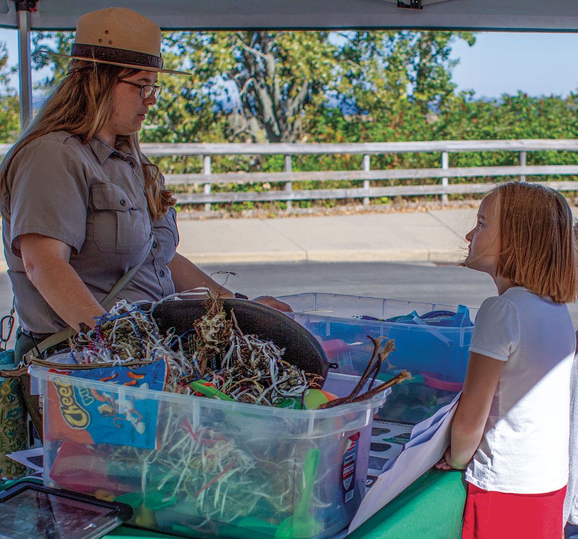 Casey Kilian, educational technician for the National Park Service, shares information on “keeping rivers and lakes clean.” Enterprise photo by Mike Anderson