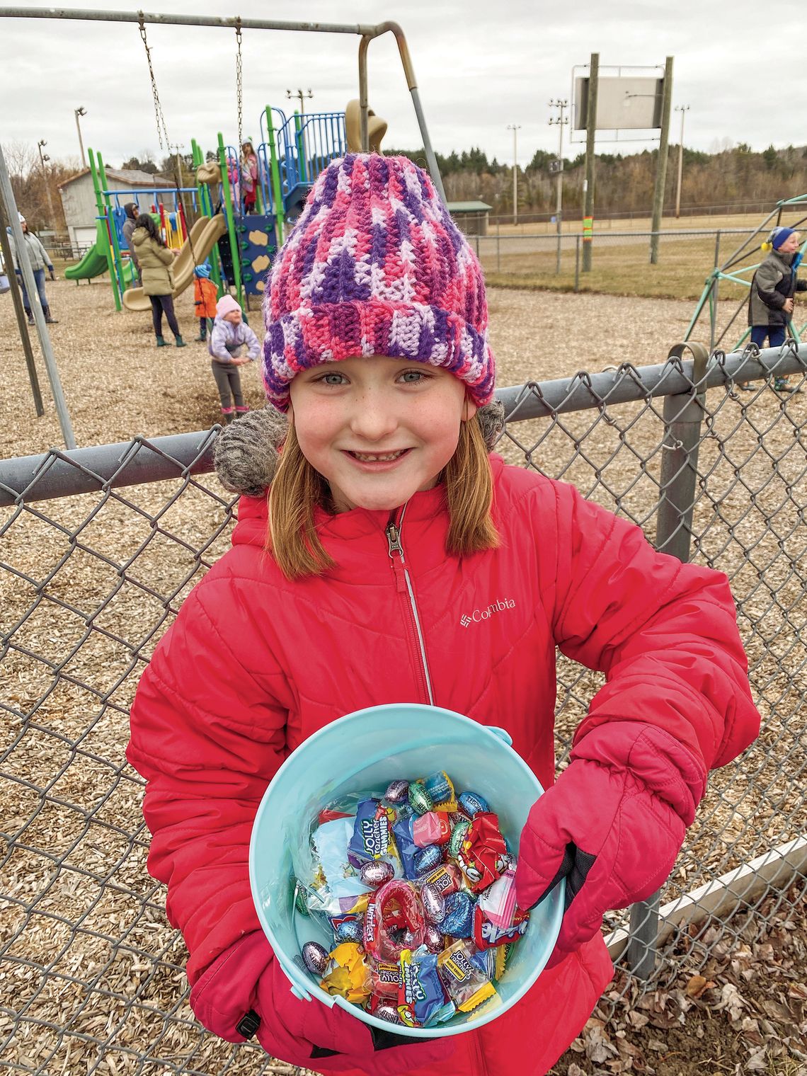 Claire Zionskowski of Elmwood Township was among the many children who bundled up Saturday for the Cedar Eggstravaganza egg hunt Saturday. Courtesy photo