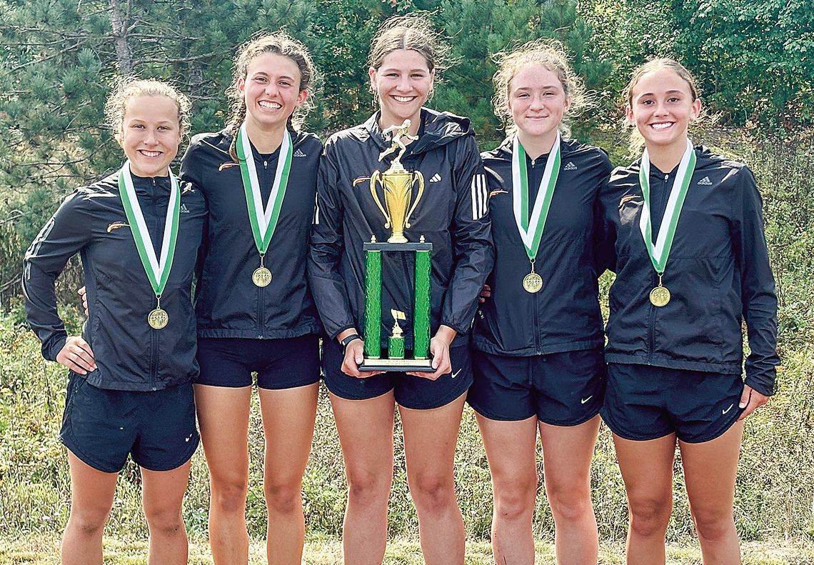 The Leland girls cross country took some hardware home after finishing first as a team at the 18th annual Logger Invitational in Boyne City on Saturday. From left to right: Natalie Burpee, Ella Knudsen, Alyssa Korson, Lorna wiesen, and Sophie Grinage. Courtesy photo
