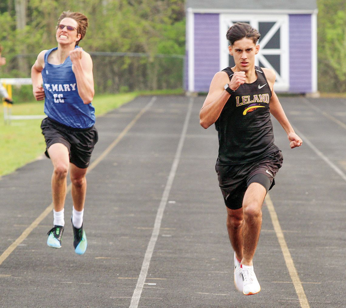 Leland senior Agustin Ceamer (right) and Lake Leelanau St. Mary sophomore Oliver Mitchell race in the 400meter run on Monday.