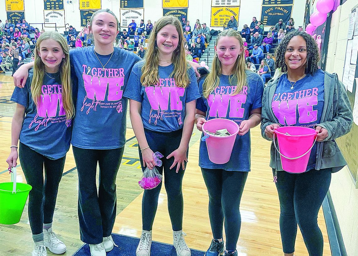 Glen LakeGlen Lake middle schoolers Glen Lake middle schoolers Cadence Bachelder, Katie Toth, Adeline Gruffey, Josalyn Eaton, and Selah Hall collet donations for Glen Lake girls basketball cancer fundraiser 'Together We Fight' basketball game against Onekama on Friday. Enterprise photo by Brian Freiberger