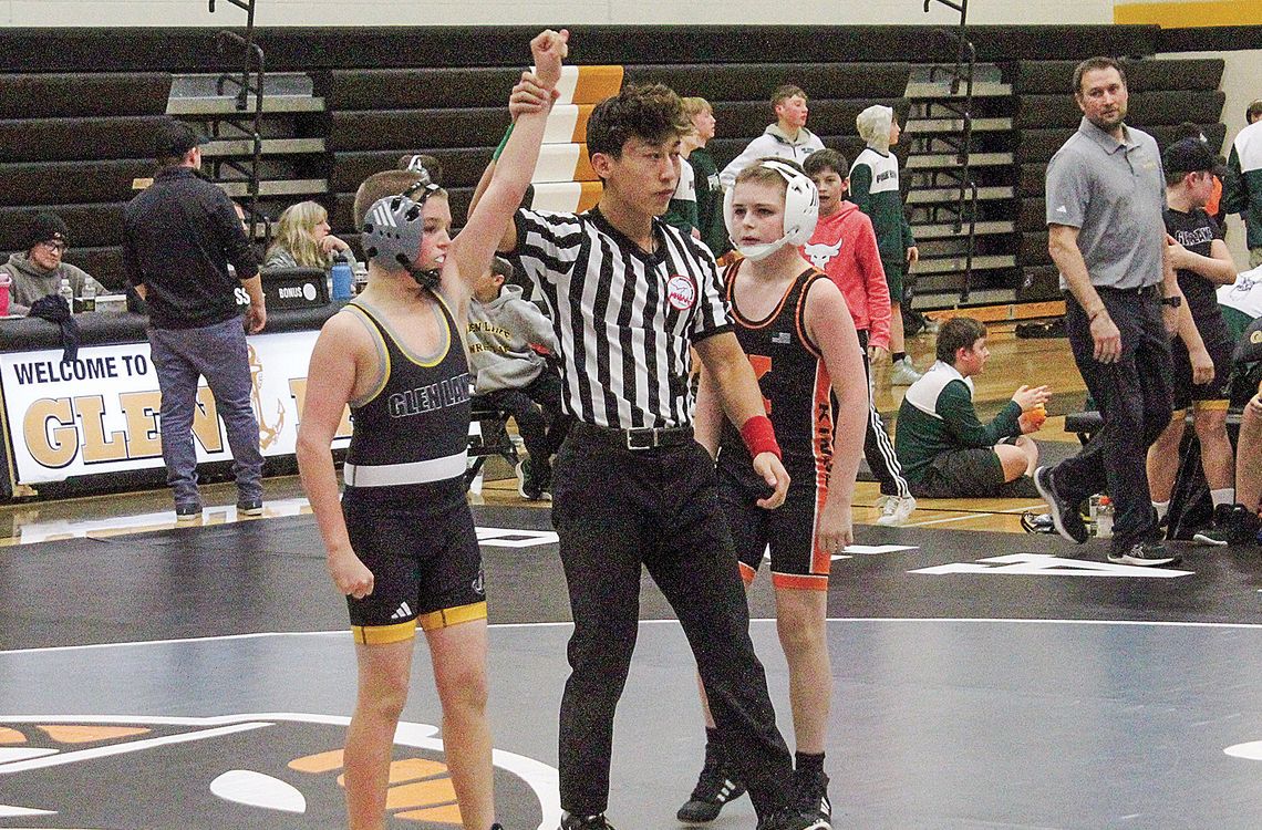 Glen Lake middle school wrestler Dylan Morgan gets his hand raised after defeating a Kinglsey wrestler on Tuesday. Enterprise photos by Brian Freiberger