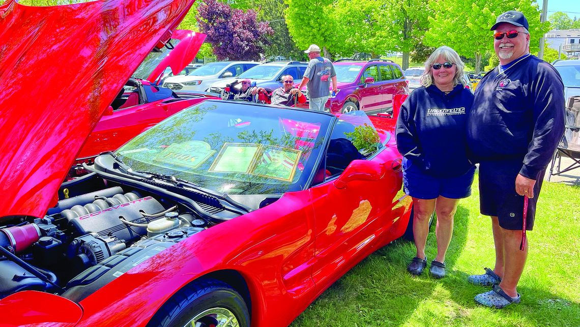 Brian and Theresa Cole of Interlochen, pictured here, brought their torch red 1998 Chevrolet Corvette to the 2023 show, placing in the windshield a framed picture of Brian’s brother, Scott, who was killed in 2001 while serving in the U.S. Army. In honor of Memorial Day, Brian said displayi...