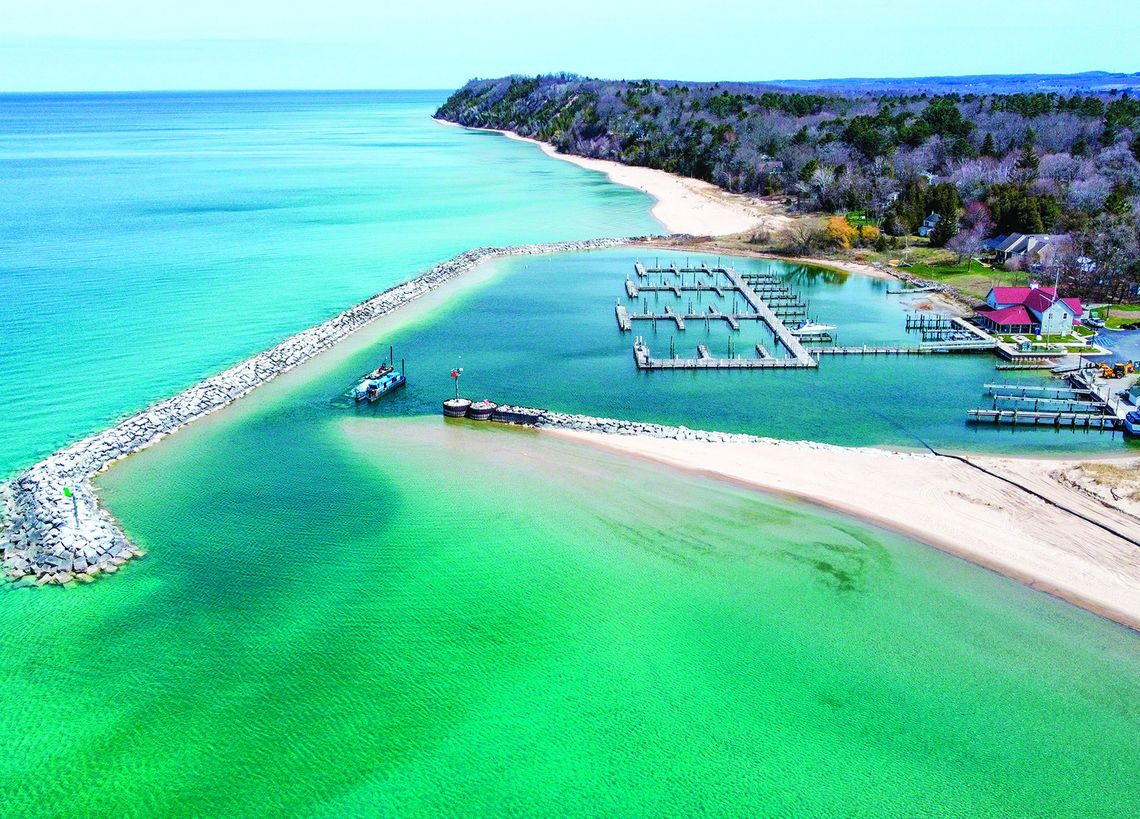 Leland harbormaster Jeremy Anderson and Jim Munoz began dredging the mouth of the Leland River this week. This is a view from above. Courtesy photo