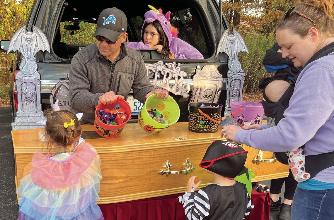 Nick Martinson of Martinson Funeral Home went all out for St. Mary School’s trunk-or-treat, bringing candy and a casket. Enterprise photo by Mike Anderson