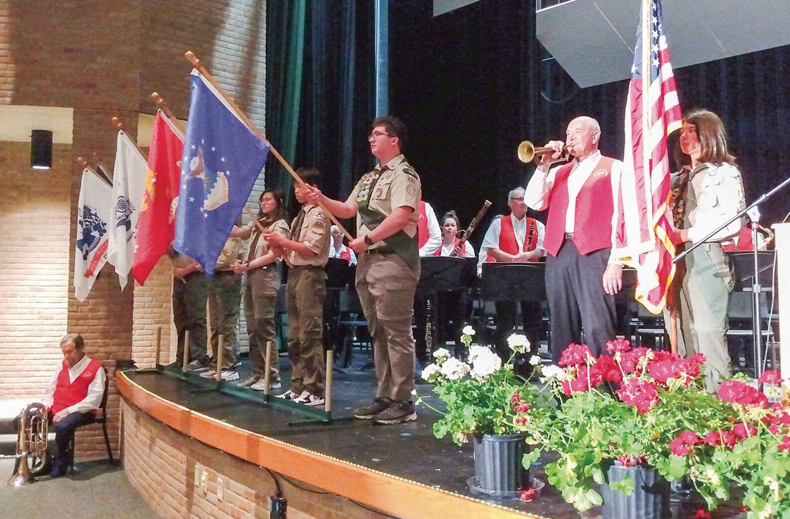The Suttons Bay Scouts display the flags of the five branches of the U.S. Armed Forces at Northport’s Memorial Day service, which was relocated to the Northport Public Schools auditorium due to rains Monday. Enterprise photo by Zachary Marano