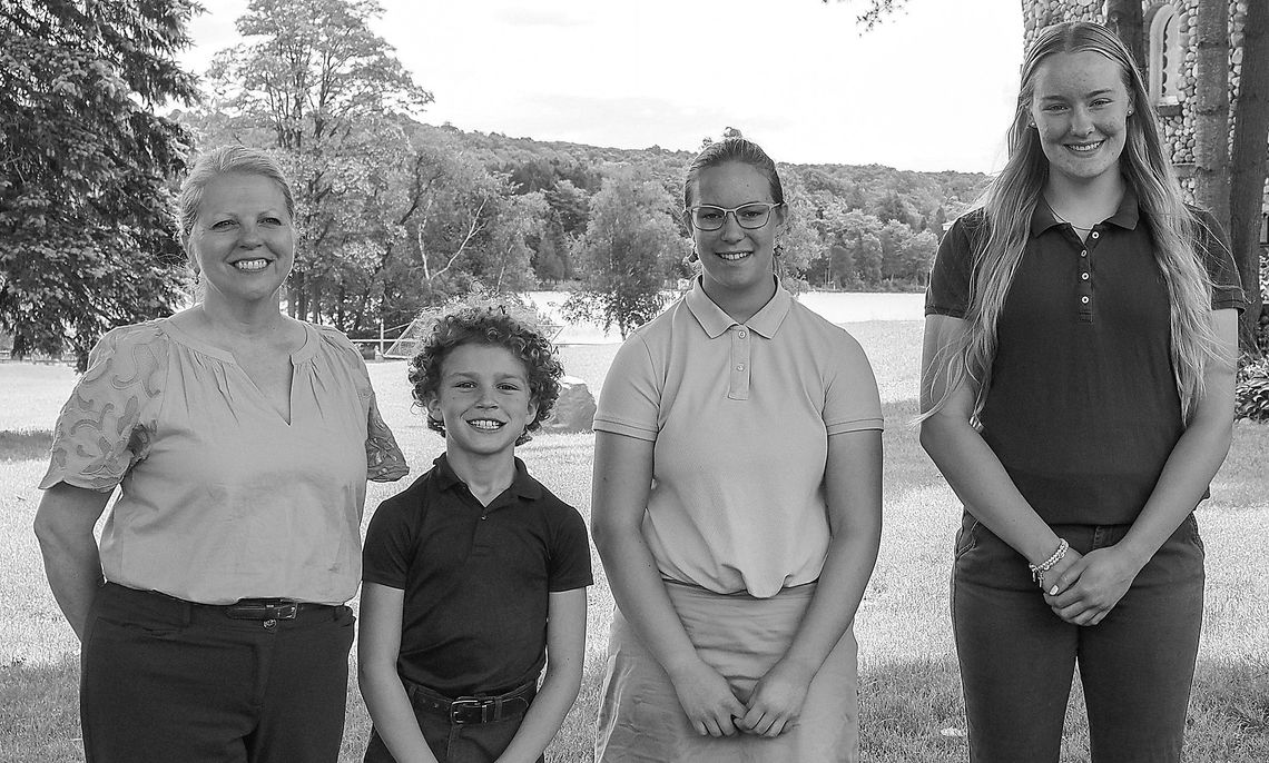 Pictured from left are Principal Megan Glynn, Michael Dunphey (fifth grade), Allison Duperon (eighth grade), and Leah Fleis (senior). Courtesy photo