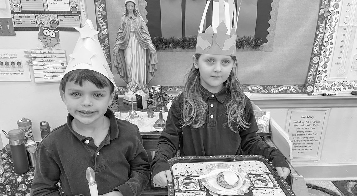 St. Mary second grade students experienced the Feast Day of St. Lucy with a traditional Swedish St. Lucia celebration. They proclaimed “St. Lucia invites you to breakfast” as they dropped off a meal to teachers and staff. Joe Mullane and Amelia Gawrysiak prepare to deliver breakfast. Court...