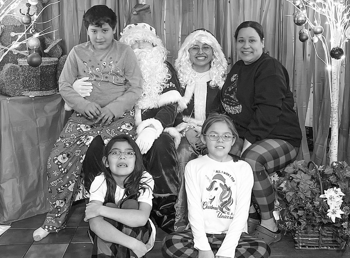 New Grand Traverse Band of Ottawa and Chippewa Indians’ (GTB) cultural department assistant/program director TaShena Sams is pictured with her three kids, Maiingan, Faith and Hope, at Christmas. Sams has been employed and working for the tribe for over 20 years now. Photo courtesy of TaShe...