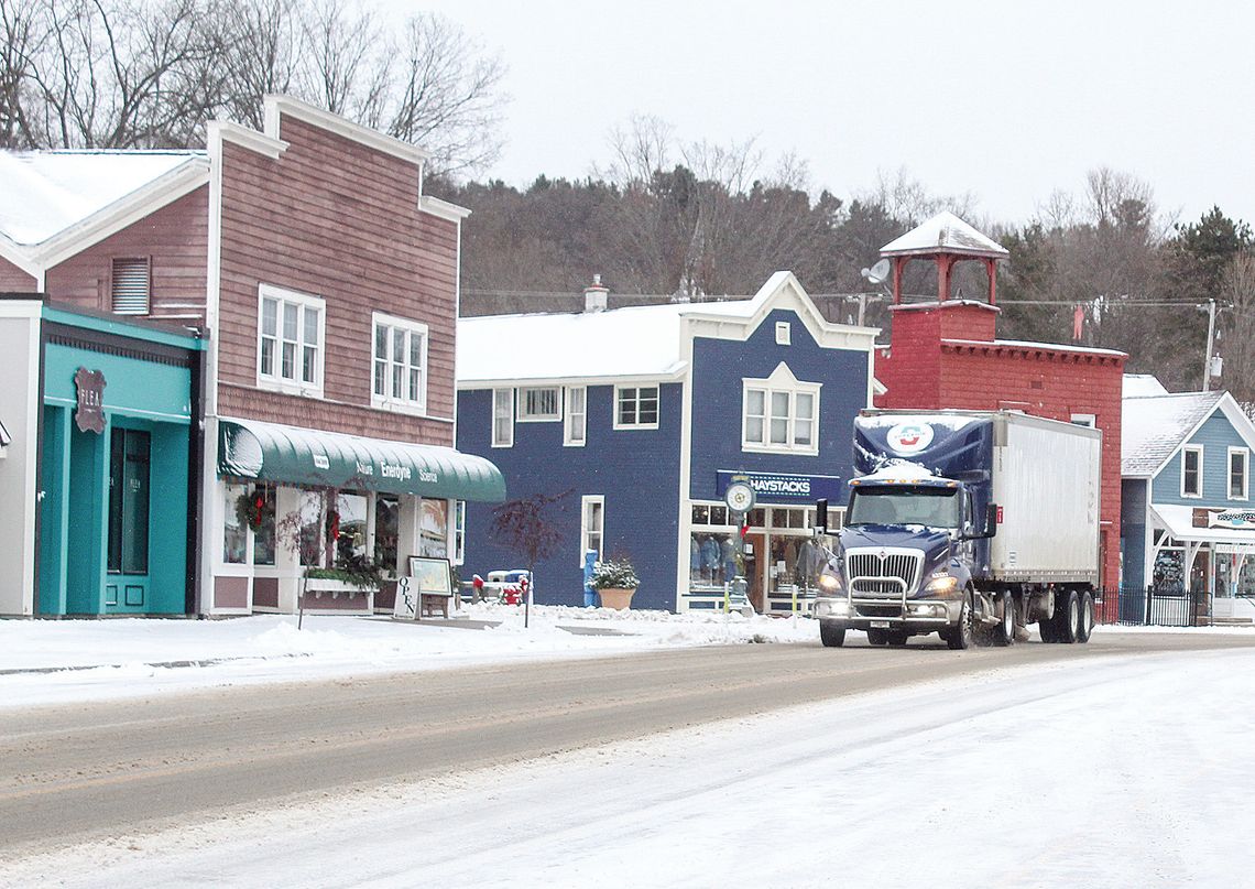 The Leelanau Road Commission and private snow plowing businesses made quick work of clearing roads for commuters after a snow storm dropped several inches and canceled school in the area. An 18-wheeler is seen passing through Suttons Bay with ease on Wednesday. Enterprise photo by Brian Fr...