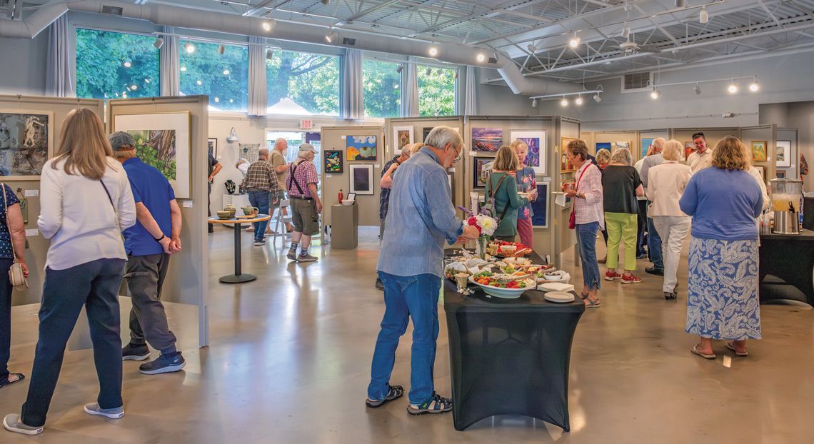 The Northport Art Association opened its Members Exhibit with a well-attended open house Friday. The exhibit runs through July 5. Photo courtesy of Sheen Watkins Photography