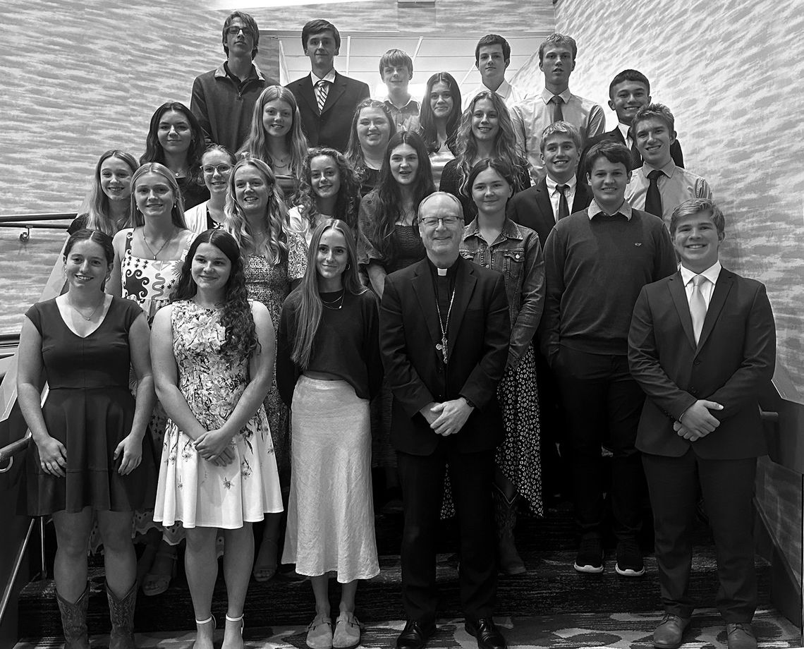 The St. Mary School chapter of Teens for Life, recently attended the Focus on Life Annual Benefit Dinner at the Grand Traverse Resort. Students pose with Bishop Jeffrey Walsh from the Diocese of Gaylord during the event.