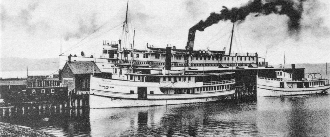 Traverse Bay Transportation Company formed in 1906, with its main dock in Traverse City. Orson Peck postcard