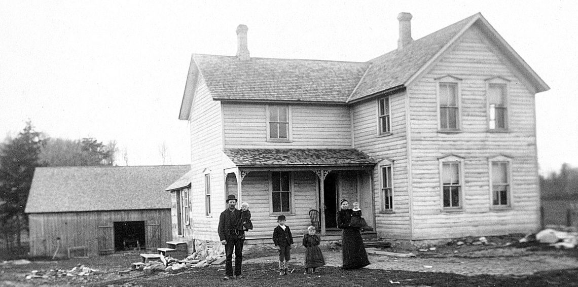 Richard and Katie Werner pose for a portrait with their family and home: from left Richard, Herman, August, Rachel, Katie, and Ella c. 1893 Photo Source: Preserve Historic Sleeping Bear Online Archive
