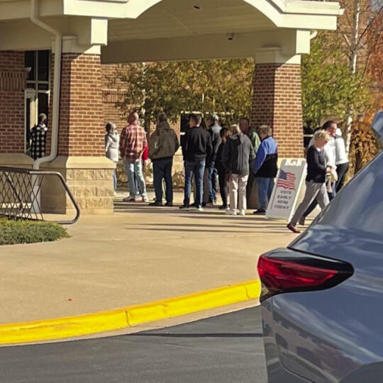 The line for early voting stretched outside the county building in the first day of early voting Saturday.