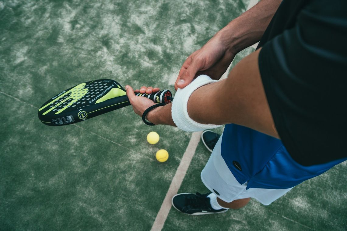 Community Sports Day person holding tennis racket